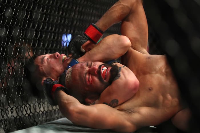 Brandon Moreno defeats Deiveson Figueiredo at UFC 263 to capture the flyweight championship belt.